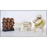 A collection of 3x reproduction case iron painted advertising money boxes - to include a Michelin