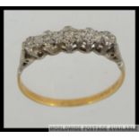 An 18ct gold and platinum vintage ladies diamond ring.