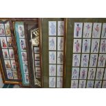 5 x Cigarette cards in a framed display.