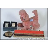 A mixed lot to include a vintage stuffed toy dog with inbuilt radio to underside, two clocks,