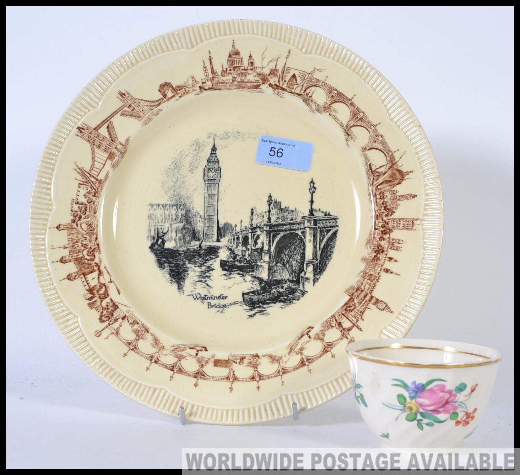 Two pieces of ceramics by Clarice Cliff to include a plate featuring West Minster Abbey along with