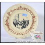 Two pieces of ceramics by Clarice Cliff to include a plate featuring West Minster Abbey along with