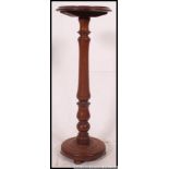 Two Victorian mahogany tripod pedestal wine table.
