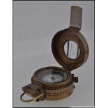 A military style brass prismatic compass,