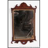 A 19th century large pier mirror. the central mirror plate with mahogany scrolled frame.