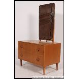 A 1960's retro upright blond oak dressing table by Meredew.