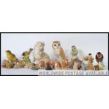 A collection of 20th century ceramic animal and bird figures to include ones by Beswick, Wade,