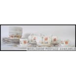 A retro Pyrex style part dinner service consisting of plates,