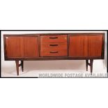 A good retro 20th century Danish influence teak sideboard raised on angular supports with a central