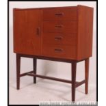 A good 1970's retro teak wood Danish influence side cabinet chest of angular form raised on tapered