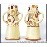 A pair of Art Deco shaped Bewley pottery flower vases.