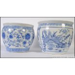 2 large Chinese blue and white ceramic carp bowls / planters with decorative designs having greek