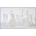 A collection of decanters to include stoppers.