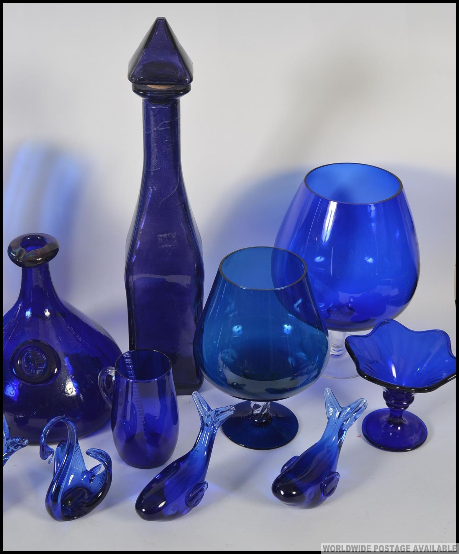 A large collection of blue glass, some possibly Bristol to include vases, decanter, beakers, mugs, - Image 2 of 4