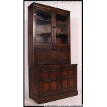 An Ercol upright colonial beech and elm dresser / cabinet.