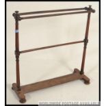 A Victorian mahogany towel rail,