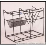 A retro 1970's black metal wire work record / vinyl hi -fi stand of angular form