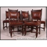 An excellent set of 6 Victorian leather and oak dining chairs in the manner of Lamb of Manchester.