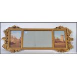 An over mantle mirror with central mirrored panel flanked by two ceramic panels W88cm