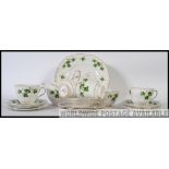 A Colclough part tea service in the Ivy pattern consisting of cups, saucers, side plates,