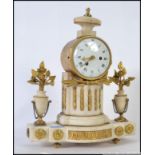 A 19th century Alabaster French mantel cylinder clock flanked by urns with gilded metal floral