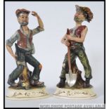 A pair of 20th century Capodimonte ceramic figures,