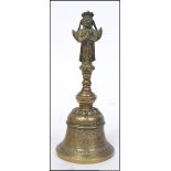 A 20th century chinese bronze bell having a cast figure of Sun Wùkong,