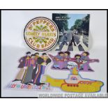 Quantity of BEATLES tin signs.