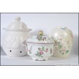 A large Poole Pottery ginger jar together with a vintage tureen with cover having apple finial.