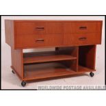 A good 1970's retro teak wood Danish influence entertainment low side cabinet of angular form