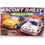 SCALEXTRIC: A Scalextric racing set ' Escort Rally ' appears complete with both cars, controllers,