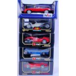 1:18 SCALE: A collection of 5x 1:18 scale boxed diecast model cars. 4x Burago and 1x Polistil model.
