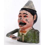 MONEY BOX: An original vintage metal alloy clown money box. Moving eyes, mouth, ears and arm.
