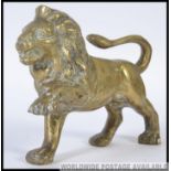 A 20th century cast brass Lion along wit