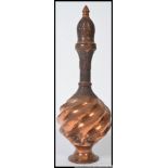 An Indian copper decorative twist design