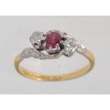 A hallmarked Birmingham 18ct and platinum ring with central red stone possibley a red emerald