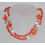 A vintage coral, opaque and gold tone gl