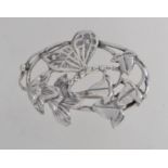 A silver Art Nouveau style brooch with a