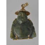 A 1950s carved jade budda pendant with y