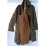 UNIFORM: A WWII Second World War British uniform great coat, along with a pair of leg breeches.