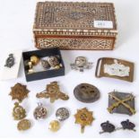 CAP BADGES: A good collection of military cap badges and other militaria - some WWI interest to