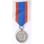 MEDAL OF MERIT; An original Polish Medal Of Merit medal, bronze. With ribbon.