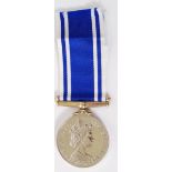 POLICE: A Police Exemplary Service medal and ribbon, unengraved to the rim.