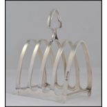 A silver hallmarked toast rack of smaller proportions,