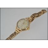 A good 9ct gold vintage ladies cyma - cymaflex dress / cocktail watch.