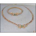 A good 9ct gold diamond and emerald necklace, earrings and bracelet set.