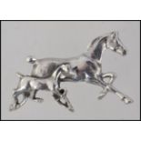 A 20th century ladies silver brooch in the form of a horse with its foal. Total weight 6.
