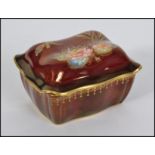 A early to mid 20th century hand painted Carlton Ware ' Rouge Royale ' cigarette box,