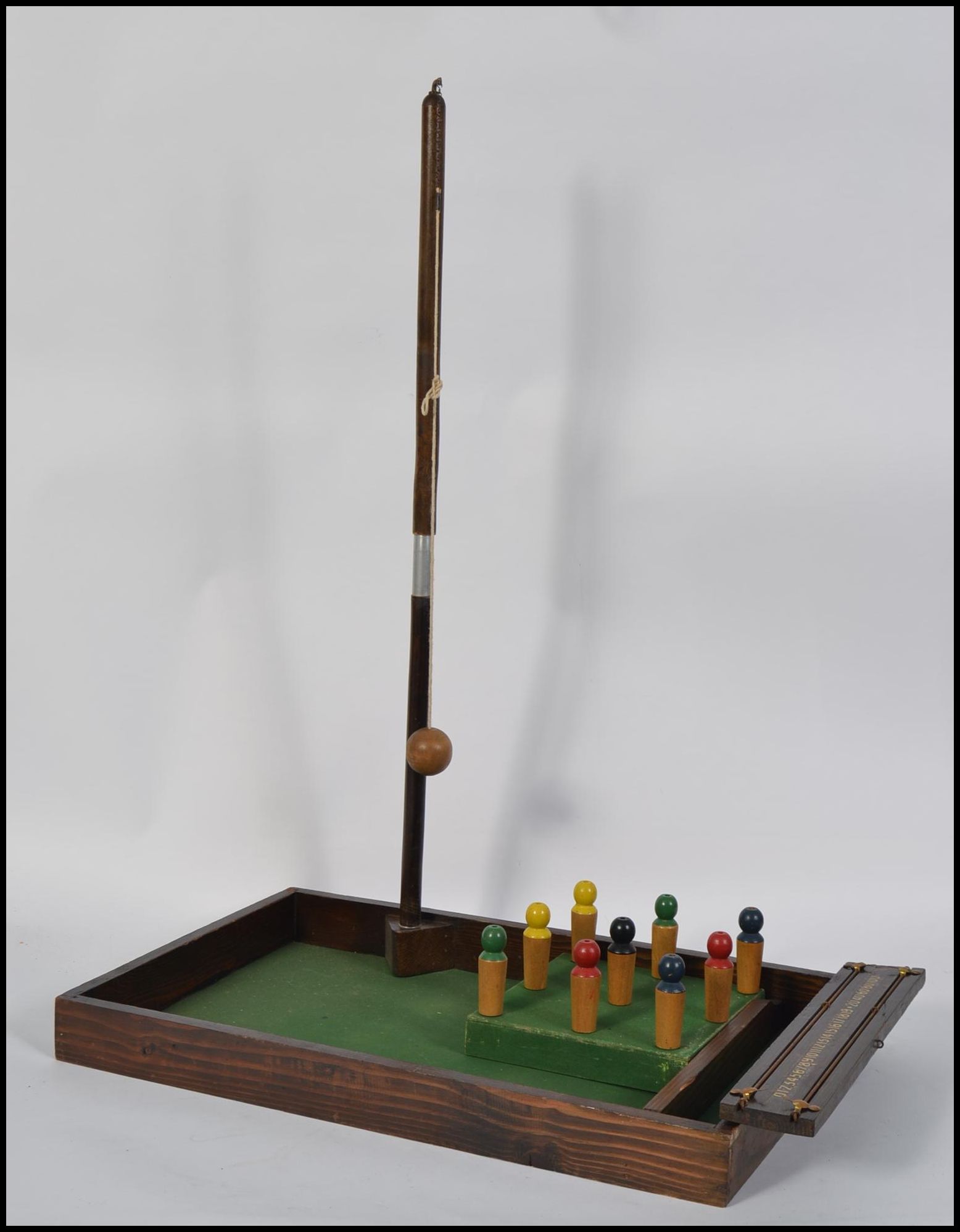 A vintage 20th century bar skittles complete with wooden base, skittles and arms,