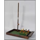 A vintage 20th century bar skittles complete with wooden base, skittles and arms,